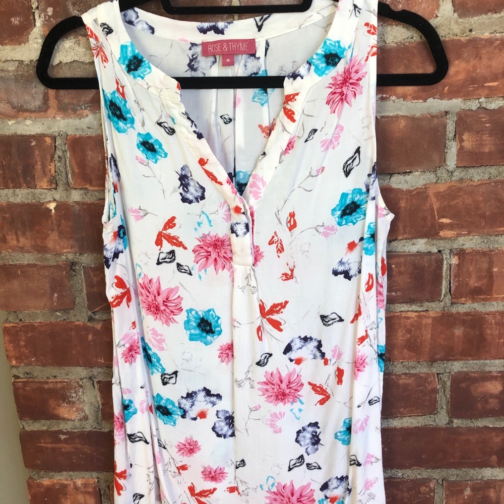 White Tank w/multi-colored floral design. Size M
